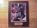 Picture: Mark Richt Georgia Bulldogs original 8 X 10 photo professionally double matted in team colors to 11 X 14 with a gold-plated plaque that reads "Mark Richt, Georgia Bulldogs." Have this custom framed in cherry wood or black and ready to hang on your wall for an additional $30.