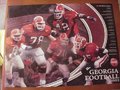 Picture: 2002 Georgia Bulldogs Schedule poster fits a standard frame and features Boss Bailey, Jon Stinchcomb, Terrence Edwards, Tony Gilbert and Karl Breedlove.