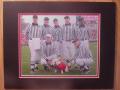 Picture: UGA VII with the referees Georgia Bulldogs original 8 X 10 photo professionally double matted to 11 X 14 so that it fits a standard frame.