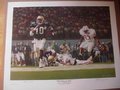 Picture: Georgia Tech Yellow Jackets "Sting of Gold" National Championship Limited Edition Print from 1990 as Shawn Jones runs past Nebraska as Tech wins the Citrus Bowl. Signed and numbered by artist Alan Zuniga.
