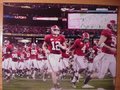 Picture: Alabama Crimson Tide 2009 SEC Champions image 2. We are the exclusive copyright holders of this image. Greg McElroy leads the team into battle original 12 X 18 panoramic print.