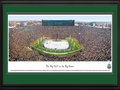 Picture: Michigan Wolverines vs. Michigan State Spartans Michigan Stadium 13 X 40 panoramic print professionally double matted in either team's colors and framed to 18 X 44. Just let us know if you want it in MSU mat colors as shown or Michigan mat colors. This panorama, taken by James Blakeway, captures the college ice hockey game between long-time rivals – the University of Michigan and Michigan State University. The match-up, known as "The Big Chill at the Big House," was held at Michigan Stadium on December 11, 2010. The event set a new world record for the largest crowd at an outdoor ice hockey game with attendance of 113,411. The past record set in May 2010, at the International Ice Hockey Federation (IIHF) World Championship game, was 77,803. This is the second outdoor ice hockey game to be played between the two storied programs. The first game, also a resounding success, occurred in 2001 and was referred to as the "Cold War."