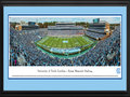 Picture: North Carolina Tar Heels Kenan Memorial Stadium 13 X 40 panoramic print professionally double matted in team colors and framed to 18 X 44. This panorama of Kenan Memorial Stadium was taken by James Blakeway. It showcases the North Carolina Tar HeelsTM football team scoring a touchdown. Located among the Carolina pines and considered one of the most picturesque athletic venues in America, Kenan Stadium has been the home of the Tar Heels® since 1927. The stadium has undergone a number of renovations over the years, including the addition of The Loudermilk Center for Excellence and a premium seating section named the Blue Zone. This 150,000 square-foot facility serves all of Carolina’s student athletes across 28 sports. North Carolina football was established in 1888 and is a member of the ACC.