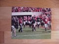 Picture: Kirby Smart leads the Georgia Bulldogs original and high quality 16 X 20 poster.