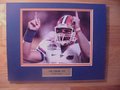 Picture: Tim Tebow Florida Gators 8 X 10 photo professionally double matted in team colors to 11 X 14 so that it fits a standard frame with a gold plate that reads "Tim Tebow, #15, Florida Gators."