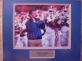 Picture: Urban Meyer Florida Gators 8 X 10 photo professionally double matted in team colors with name plate to 11 X 14 so that it fits a standard frame.