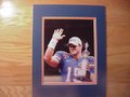 Picture: Tim Tebow final Florida Gators game 8 X 10 photo of Tebow holding the Sugar Bowl Trophy professionally double matted to 11 X 14 so that it fits a standard frame.