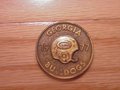 Picture: Georgia Bulldogs 1977 original schedule coin is 1 1/2 X 1 1/2 and five inches around. From 33 years ago, this coin has the 1977 schedule on back. We have just one!