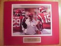 Picture: Bobby Petrino game plans with Ryan Mallett Arkansas Razorbacks original 8 X 10 photo double matted to 11 X 14 so that it fits a standard frame with gold-colored name plate.
