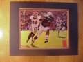 Picture: Cam Newton of the Auburn Tigers runs for a touchdown against Georgia original 8 X 10 photo professionally double matted in Auburn colors to 11 X 14.