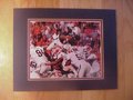 Picture: Cam Newton of the Auburn Tigers dives for a touchdown against Georgia original 8 X 10 photo professionally double matted in Auburn colors to 11 X 14.