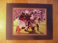 Picture: Cam Newton of the Auburn Tigers scores a touchdown against Georgia original 8 X 10 photo professionally double matted in Auburn colors to 11 X 14.