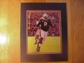 Picture: Cam Newton of the Auburn Tigers runs past Georgia original 8 X 10 photo professionally double matted to in Auburn colors to 11 X 14.