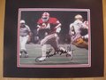 Picture: Herschel Walker Georgia Bulldogs hand-signed 8 X 10 photo against Notre Dame in the 1980 National Championship/Sugar Bowl professionally double matted to 11 X 14. The autograph is absolutely guaranteed authentic and comes with a Certificate of Authenticity.