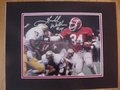 Picture: Herschel Walker Georgia Bulldogs hand-signed 8 X 10 photo against Notre Dame in the 1980 National Championship/Sugar Bowl professionally double matted to 11 X 14. The autograph is absolutely guaranteed authentic and comes with a Certificate of Authenticity.