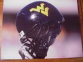 Picture: West Virginia Mountaineers original 8 X 10 football helmet photo great for autographs.