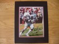 Picture: Herschel Walker Georgia Bulldogs hand-signed 8 X 10 photo professionally double matted to 11 X 14. The autograph is absolutely guaranteed authentic and comes with a Certificate of Authenticity.