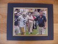 Picture: Paul Johnson and Justin Thomas confer in the Georgia Tech Yellow Jackets 42-38 win over Georgia Southern original 8 X 10 photo double matted in team colors to 11 X 14 to fit a standard frame.