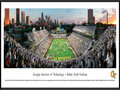 Picture: Georgia Tech Yellow Jackets Bobby Dodd Stadium 13.5 X 40 print professionally framed to 13.75 X 40.25. This panorama of the 100th anniversary of Historic Grant Field was taken by James Blakeway. Bobby Dodd Stadium at Grant Field, originally built in 1913, has been home to Georgia Tech football for more than a century. One of the best venues in the country to watch college football, the facility is the oldest on-campus stadium in NCAA Division 1-A (FBS). The facility was known as Grant Field until 1988, when the name Bobby Dodd Stadium was added in honor of the legendary coach who guided the Rambling Wreck to an illustrious football era. In true Georgia Tech style, the Rambling Wreck rolled onto the field and fans dressed in white at this nationally televised event.