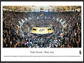 Picture: Purdue Boilermakers Mackey Arena 13.5 X 40 panoramic poster professionally framed to 13.75 X 40.25. This panorama of Mackey Arena, taken by James Blakeway, highlights the Purdue Boilermakers men's basketball team playing before a sold-out crowd. Originally opened as Purdue Arena in 1967, it was renamed in 1972 to honor long-time athletics director and Purdue alum Guy "Red" Mackey. The arena stadium seats 14,123 fans and is considered one of the loudest in the nation. The men's basketball program started in 1896, competes in the Big Ten Conference and has won more league championships than any other school in the conference. Established in 1869 in West Lafayette, Indiana, the University today enrolls more than 39,000 students.