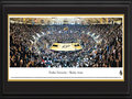 Picture: Purdue Boilermakers Mackey Arena 13.5 X 40 panoramic poster professionally double matted in team colors and framed to 18 X 44. This panorama of Mackey Arena, taken by James Blakeway, highlights the Purdue Boilermakers men's basketball team playing before a sold-out crowd. Originally opened as Purdue Arena in 1967, it was renamed in 1972 to honor long-time athletics director and Purdue alum Guy "Red" Mackey. The arena stadium seats 14,123 fans and is considered one of the loudest in the nation. The men's basketball program started in 1896, competes in the Big Ten Conference and has won more league championships than any other school in the conference. Established in 1869 in West Lafayette, Indiana, the University today enrolls more than 39,000 students.