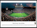 Picture: Purdue Boilermakers Ross-Ade Stadium 13.5 X 40 panoramic poster professionally framed to 13.75 X 40.25. This panorama of Ross-Ade Stadium, taken by Robert Pettit, captures the excitement of a Purdue Boilermakers' football game. Nestled on the northern edge of campus, Ross-Ade Stadium is named after principal benefactors David E. Ross and George Ade. Ross-Ade Stadium opened in the fall of 1924 with a seating capacity of 13,500. After multiple renovations, the current capacity is 62,500. From 2001 to 2003, Ross-Ade Stadium underwent a renovation that made it one of the most attractive and fan-friendly facilities in all of college football. Located on 150 acres in West Lafayette, Indiana, Purdue University was founded in 1869 by philanthropist and businessman John Purdue. Presently, enrollment tops 39,000 students.