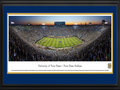 Picture: 2014 Notre Dame Fighting Irish Notre Dame Stadium panoramic poster of the team's 31-0 win over Michigan professionally double matted in team colors and framed. This panorama, taken by Christopher Gjevre, spotlights the Notre Dame Fightin’ Irish hosting the Michigan Wolverines in the much anticipated matchup between these two teams. Notre Dame celebrated a 31-0 victory in front of a sellout crowd of 80,795 fans. The shutout was the first in the series for the Irish, securing a 10-9-1 all-time record over the Wolverines in Notre Dame Stadium. The Notre Dame-Michigan series began on November 23 1887, Notre Dame's very first football game. After Notre Dame beat Michigan for the first time in 1909, the Wolverines refused to play the Irish on a regular basis until 1978. The game photographed here marked the last one to be played between the two teams.