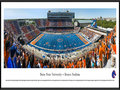 Picture: Boise State Broncos Bronco Stadium panoramic poster of the team's 2013 home opener, a 63-14 win over Tennessee-Martin in Chris Petersen's last year, professionally framed. This panorama of Bronco Stadium, taken by Christopher Gjevre, spotlights the Boise State Broncos football team playing their home opener against the University of Tennessee-Martin Skyhawks. This game also commemorates the opening of the Bleymaier Football Center, the Broncos new 70,000 square-foot athletic football complex in the north end zone. The Boise State players made their entrance onto the field through the new state-of-the-art complex, which houses a recruiting and players’ lounge, a weight room big enough for the entire team to work out and, of course, it has the infamous blue turf. Boise State fans added to the game day festivities by striping the stadium.