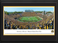 Picture: Missouri Tigers Memorial Stadium/Faurot Field panoramic print professionally double matted in team colors and framed. This panorama, taken by James Blakeway, spotlights a blaze of gold as the University of Missouri Tigers crushed their second consecutive ranked opponent for the first time since 1976. Playing on home turf, the Tigers defeated the Florida Gators with a final score of 36-17. The storied history of Memorial Stadium/Faurot Field, also known as “The Zou,” dates back to its opening in 1926. Today, fans enjoy the many changes to the stadium that have occurred, including an expansion to the north concourse area and moving the hill closer to the field. In the process, the Rock M was safely stored and reconstructed to maintain the important historical landmark that Tiger fans have grown to love.