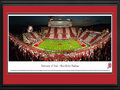 Picture: Utah Utes Rice-Eccles Stadium 13.5 X 40 panoramic poster against in-state rival Utah State Aggies professionally double matted in Utes' colors and framed to 18 X 44. his panorama, taken by Christopher Gjevre, captures the Utah Utes football team playing its season opener against in-state opponent, the Utah State Aggies. Utah and Utah State is the oldest rivalry in Utah football history, with the two schools competing in over 110 games since 1892. While the Utes and Aggies no longer compete in the same conference, the two programs will continue to face one another in competition. The Utah football program began in 1892 and has played home games at the beautiful Rice-Eccles Stadium since 1927. This game marked Utah's first-ever “Stripe the Stadium” promotion, asking Ute fans to wear either red or white, depending on the location of their seats.