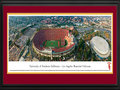 Picture: USC Trojans Los Angeles Memorial Coliseum 13.5 X 40 panoramic poster professionally double matted in team colors and framed to 18 X 44. This panorama, photographed by Christopher Gjevre, captures the USC Trojans football team playing on their home turf at Memorial Coliseum. Built in 1923, the Los Angeles Memorial Coliseum, located on 17 acres in Exposition Park, is currently the sixth largest college football stadium with a capacity of 93,607. Established in 1888, the Pacific-10 Conference Trojans have been a football powerhouse, claiming 11 national titles, 37 conference titles, 46 bowl game appearances, and over 750 all-time wins. The University of Southern California, founded in 1880 in Los Angeles, California, is California's oldest private research university. Today, enrollment exceeds 33,500 students.