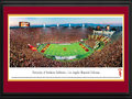 Picture: USC Trojans Los Angeles Memorial Coliseum 13.5 X 40 panoramic poster professionally double matted in team colors and framed to 18 X 44. This panorama, photographed by Christopher Gjevre, captures the University of Southern California Trojans battling a Pac-12 conference opponent. The USC Trojans football program, established in 1888, is a football powerhouse with more players selected for the NFL Draft than any other university. In 2009, the Trojans were named "Team of the Decade" by CBS Sports and "Program of the Decade" by Sports Illustrated. USC is the oldest private research university in the western United States, with two main campuses in the Los Angeles area. The Trojan Family consists of more than 240,000 living alumni in positions of leadership all over the world.