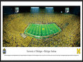 Picture: Michigan Wolverines Michigan Stadium 13.5 X 40 panoramic print professionally framed. Considered among the most elite of college programs, this panorama memorializes the Michigan-Notre Dame football rivalry at its finest. The historic first game between the Michigan Wolverines and the Notre Dame Fighting Irish dates back to 1887, with the Wolverines winning the first eight contests. Fast forward 125+ years and, in front of a NCAA-record crowd of 115,109, the Wolverines once again were victorious with a final score of 41-30. This game, “Under the Lights II,” was only the second night game ever played at the Big House. Michigan currently ranks ahead of Notre Dame in both winning percentage and all time wins.