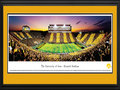 Picture: Iowa Hawkeyes Kinnick Stadium 13 X 40 panoramic print professionally double matted in team colors and framed to 18 X 44. This panorama, photographed by Robert Pettit, captured the Iowa Hawkeyes football team playing the Black and Gold Spirit Game at Kinnick Stadium to a sold out crowd. The University of Iowa's fans showed their spirit by wearing gold in the even numbered sections and black in the odd sections, which gave them the opportunity to "Paint the Town Black and Gold" and "stripe" historic Kinnick Stadium in their school colors. Iowa Hawkeyes football was founded in 1889, completed its first undefeated season in 1899, and began competing in the Big Ten Conference in 1900. The University is located in Iowa City, Iowa, and is considered one of America's ‘Public Ivy' universities.