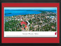 Picture: Wisconsin Badgers Camp Randall Stadium with beautiful Lake Mendota 13 X 40 panoramic print professionally double matted in team colors and framed to 18 X 44. This aerial panoramic photograph of the University of Wisconsin was taken by James Blakeway. It features the Madison Campus and Camp Randall Stadium during a Wisconsin Badgers football game. The university campus rests in a unique and beautiful setting on the shore of Lake Mendota. Featured at the far right is the Wisconsin State Capitol with its domed roof. Camp Randall Stadium, originally built in 1917, is the home for the University of Wisconsin Badgers football team. The current capacity of 80,321 ranks among the nation's largest school-owned stadiums and has ranked among the top 16 in the nation for attendance.