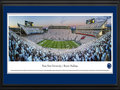 Picture: Penn State Nittany Lions Beaver Stadium 13 X 40 panoramic print professionally double matted in team colors and framed to 18 X 44. This panorama, taken by Christopher Gjevre, captures the excitement of the Penn State Nittany Lion fans as their team scores a touchdown during a sell-out homecoming game that ultimately resulted in a stunning win over Michigan at Beaver Stadium™. Nittany Lion fans showed their Penn State pride and wore white at the game for the all-stadium white out, cheering their team to victory in the fourth overtime. In addition to the Saturday evening football game, homecoming festivities included the annual parade that starts at Beaver Stadium and winds through campus and College Avenue, the first event at the new Pegula Ice Arena, as well as numerous other athletic events throughout the weeken