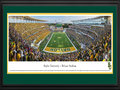 Picture: Baylor Bears McLane Stadium 13 X 40 panoramic print professionally double matted in team colors and framed to 18 X 44. This panorama, taken by James Blakeway, captures the Baylor Bears football team playing its inaugural game at the new McLane Stadium, ending the evening with a 45-0 victory over SMU. The Bears’ home opener was completely sold out in record time, as fans hurried to witness Baylor’s first on-campus football game since 1935. Built on a 93-acre site along the Brazos River, the new stadium also serves as a catalyst for business activity and economic development for the City of Waco. Around the site there are tailgating opportunities, as well as an option to take tailgating to the water in the most unique fashion, as fans are now able to boat to Baylor games. The new facility seats 45,145 fans with future expansion possible to 55,000.