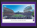 Picture: Kansas State Wildcats Bill Snyder Family Stadium 13 X 40 panoramic print professionally double matted in team colors and framed to 18 X 44. This panorama, taken by James Blakeway, spotlights a mid-season game between two Big 12 Conference teams, the K-State Wildcats and the West Virginia Mountaineers. Adding to the excitement and serving as a backdrop is the recently completed West Stadium Center at Bill Snyder Family Stadium. The 250,000 square-foot west-side stadium expansion features a student-athlete dining hall, the Athletics Hall of Honor, new concessions and restrooms, premium seating, press box, field lighting and other amenities. The first-class facility also serves as the northwest gateway to Kansas State University’s beautiful campus.