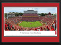 Picture: North Carolina State Wolfpack Carter-Finley Stadium 13 X 40 panoramic print professionally double matted in team colors and framed to 18 X 44. This panorama, taken by James Simmons, captures the action of the NC State Wolfpack playing in front of a sell-out crowd in Carter-Finley Stadium. Athletics at NC State began with football in 1892, a game between students from the North Carolina Agricultural and Mechanical College and the Raleigh Male Academy, on the grounds of what is now Pullen Park. From those humble beginnings, NC State University has been competing at the highest level of college athletics for more than a century, as a charter member of both the Southern Conference and, later, the Atlantic Coast Conference.