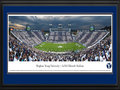 Picture: Brigham Young Cougars LaVell Edwards Stadium 13 X 40 panoramic print professionally double matted in team colors and framed to 18 X 44. This panorama of LaVell Edwards Stadium was taken by Robert Pettit. It spotlights the Brigham Young Cougars playing against Georgia Tech, an ACC opponent. The game was the grand finale of events throughout BYU Homecoming week, including a spectacular win for the Cougars. The game was also a sectional striped game, where fans sitting in odd sections are asked to wear dark blue and fans sitting in even sections are asked to wear white. The True Blue Foam tradition, one of the most popular Homecoming activities among students, was also a part of the weeks’ events, when students converge on Helaman Fields to show their spirit while diving, sliding and dancing into a sea of blue foam.