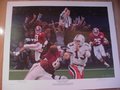 Picture: This is an original print from 1993 of the 1992 National Championship Game entitled "Crimson Domination." 22 X 28 original print in excellent shape with no pin holes or tears of the Alabama Crimson Tide winning the National Championship over Miami 34-13 with Gene Stallings, Eric Curry, George Teague high stepping in an interception return for a touchdown and MVP Derrick Lassic at the Sugar Bowl. This is a signed Printers' Proof by artist Alan Zuniga.