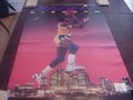 Picture: This is an original Magic Johnson Los Angeles Lakers "Magic Kingdom" Costacos Brothers full size 23 X 35 poster from 1991 in excellent shape with no pin holes or tears but mild crease bottom right corner and mini wear on black in upper corners. This poster shows Magic leaping over the Los Angeles skyline. We only have one of this extremely rare poster!
