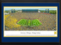 Picture: Just out as the Jim Harbaugh era begins for the Michigan Wolverines in Ann Arbor, Michigan with a 35-7 trouncing of Oregon State on September 12, 2015! Michigan Wolverines Michigan Stadium panoramic poster professionally double matted in team colors and framed to 18 X 44. This panorama, taken by James Blakeway, captures the University of Michigan Wolverines in their home opener against the Oregon State University Beavers. It marks the first home game for J. Ira and Nicki Harris Family Head Football Coach Jim Harbaugh. The game also kicks off a year-long celebration of Michigan Athletics' 150th Anniversary. The Michigan Wolverines intercollegiate competition officially began its rich and storied tradition in the season of 1865-66 and, since that time, the athletic teams have claimed many national championships, beginning with football’s 1901 national title.