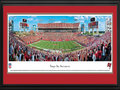 Picture: This 13.5 X 40 panorama of the Tampa Bay Buccaneers playing at Raymond James Stadium is professionally double matted in team colors and framed to 18 X 44. Raymond James Stadium has been home to the Tampa Bay Buccaneers since 1998. It boasts a number of unique features including a pirate ship that comes to life after the Buccaneers score a field goal or touchdown. The club's nickname, "Buccaneers," is a reference to the pirate legends of Southwest Florida. The Buccaneers are the first NFL franchise to have won the Super Bowl after losing at home on the opening day of the season. From the NFL Stadiums collection.