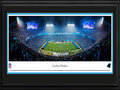 Picture: This 13.5 X 40 panorama has been professionally double matted and framed in team colors to 18 X 44. It highlights the Carolina Panthers hosting the Arizona Cardinals for a playoff game at Bank of America Stadium in Charlotte, North Carolina. In 1993, the Panthers were selected as the 29th NFL franchise. In the summer of 1996, Bank of America Stadium opened on 33 acres of land in uptown Charlotte and was specifically designed for football. Following the 2013 season, a renovation project incorporated four escalator towers for easy access to upper level seats, and state-of-the-art technology, including high-definition video boards, vibrant ribbon boards and a distributed sound system throughout the bowl, continuing to make this classic American stadium one of the most striking and fan-friendly in the NFL. From the NFL Stadiums collection.