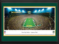 Picture: This 13.5 X 40 panorama has been professionally double matted in team colors and framed to 18 X 44. It highlights the Green Bay Packers playing a victorious Sunday night game at the historic Lambeau Field. The Packers home field was dedicated as City Stadium on September 29, 1957, and renamed Lambeau Field in 1965 in tribute to Curly Lambeau. In 2007, the Packers celebrated the 50th anniversary of the opening of Lambeau Field. The Green Bay Packers have won more championships than any other team in the National Football League. The Super Bowl trophy, awarded each year to the winning team of the the NFL's championship game, was renamed in 1970 in memory of Vince Lombardi, legendary head coach of the Green Bay Packers. From the NFL Stadiums collection.