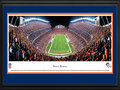 Picture: This 13.5 X 40 panorama of the Denver Broncos playing at Invesco Field has been professionally double matted in team colors and framed to 18 X 44. The club reached the NFL's pinnacle by capturing its first World Championship in Super Bowl XXXII. Since 1960 the Denver Broncos have grown into a team that is followed by legions of fans throughout the Rocky Mountain region. The Broncos popularity has translated into several home game traditions, and one such tradition is called the "Incomplete Chant." It begins when the opposing team throws an incomplete pass, the stadium announcer then broadcasts the incomplete pass, the fans complete the chant by saying "in-com-plete," and the process ends with the sound effect of the "sad trombone." From the NFL Stadiums collection.