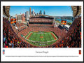 Picture: This panorama has been professionally framed to 13.75 X 40.25. It captures the Cincinnati Bengals as they host the Seattle Seahawks at Paul Brown Stadium, located on the north bank of the Ohio River. While members of the modern era American Football League, the Bengals played at Nippert Stadium on the campus of the University of Cincinnati from 1968-69. When the AFL merged with the NFL in 1970, the team moved into a new venue called Riverfront Stadium (later renamed Cinergy Field), which also was situated on Cincinnati’s downtown riverfront. They played there for 30 seasons from 1970-99. Paul Brown Stadium, which opened in 2000, is named after Bengals founder and Pro Football Hall of Famer Paul Brown. From the NFL Stadiums collection.