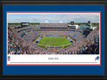 Picture: This 13.5 X 40 panorama has been professionally double matted in team colors and framed to 18 X 44. It captures the excitement as the Buffalo Bills hosted their longtime division rival, the Miami Dolphins, in their home opener at the newly renovated Ralph Wilson Stadium. In the first game after the passing of the Bills founding owner, Ralph C. Wilson, Jr., in the stadium that bears his name, Wilson was honored in a special pregame ceremony. The Bills went on to win the game in front of a sellout crowd by a score of 29-10, a memorable day in their rich history that includes two consecutive AFL Championships in 1964 and 1965, and four consecutive Super Bowl appearances from 1990 to 1994. From the NFL Stadiums collection.