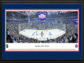 Picture: This 13.5 X 40 panorama has been professionally double matted in team colors and framed to 18 X 44. It spotlights one of the NHL’s youngest teams, the Columbus Blue Jackets, playing against the Pittsburgh Penguins on their home ice in Columbus, Ohio. It all began in June 1997, when the National Hockey League awarded the city of Columbus an expansion franchise that would later be named the Blue Jackets. Just over three years later, on October 7, 2000, the club played its inaugural game before a sellout crowd of 18,136 fans. The name “Blue Jackets” was chosen to celebrate the patriotism, pride and rich Civil War history of the state of Ohio and the city of Columbus. The Blue Jackets play their home games at Nationwide Arena in downtown Columbus, which opened in 2000.